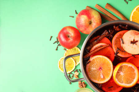 Concept of cooking mulled wine on green backgroundの写真素材