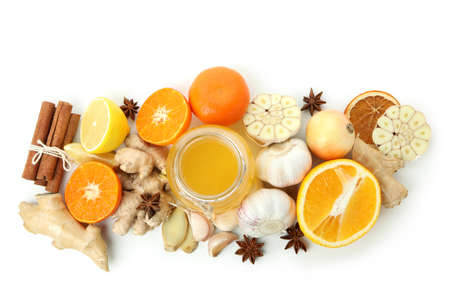 Concept of treatment colds with honey and garlic isolated on white background