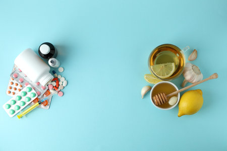 Concept of treatment colds with honey and garlic on blue backgroundの写真素材