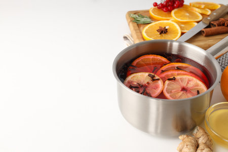Concept of cooking mulled wine on white backgroundの写真素材