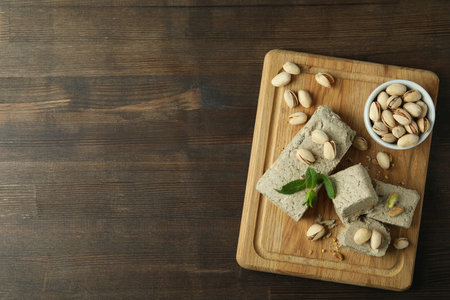 Concept of tasty food with halva on wooden backgroundの写真素材