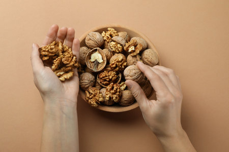 Concept of healthy food with walnuts on beige backgroundの写真素材