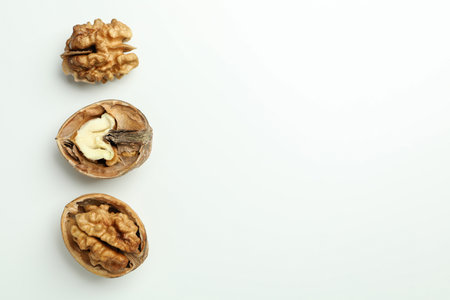 Walnuts with nutshell on white background, top viewの写真素材