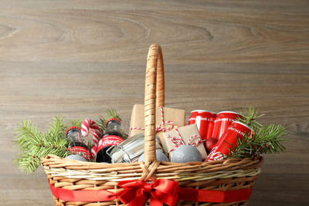 Odessa, Ukraine - November 10, 2021: Concept of gift with Christmas basket on wooden backgroundのeditorial素材
