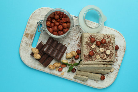 Concept of tasty food with halva on blue backgroundの写真素材