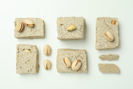 Flat lay with halva and pistachio on white backgroundの写真素材