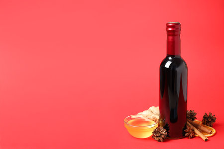 Ingredients for cooking mulled wine on red backgroundの写真素材