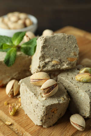 Concept of tasty food with halva on wooden backgroundの写真素材