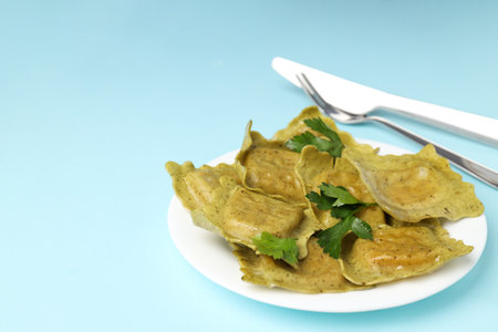 Delicious food concept with ravioli on blue backgroundの写真素材