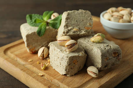 Concept of tasty food with halva on wooden backgroundの写真素材