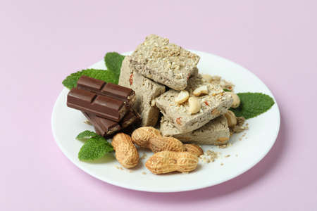 Concept of tasty food with halva on purple backgroundの写真素材