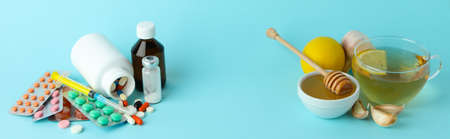 Concept of treatment colds with honey and garlic on blue backgroundの写真素材