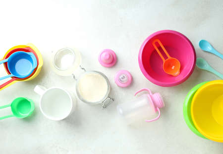 Concept of baby food with powdered milk on white textured backgroundの写真素材