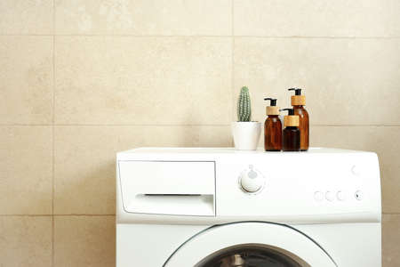 Concept of housework with washing machine in bathroom