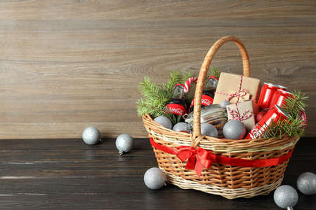 Odessa, Ukraine - November 10, 2021: Concept of gift with Christmas basket on dark tableのeditorial素材