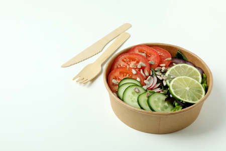 Concept of food delivery with vegetable salad on white backgroundの写真素材