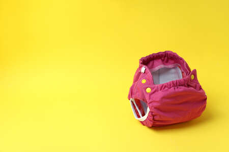 Reusable diapers on yellow background, close upの写真素材