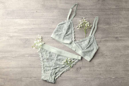 Concept of women's clothes with underwear on gray textured backgroundの写真素材