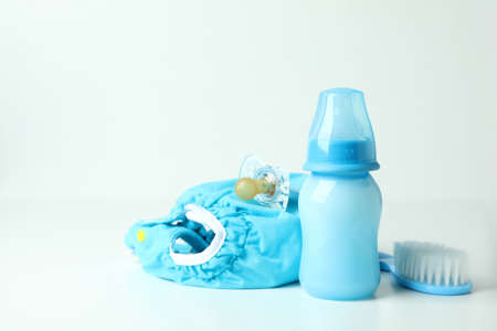 Concept of baby clothes with reusable diapers on white tableの写真素材