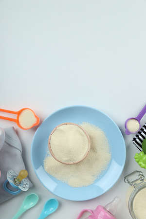 Concept of baby food with powdered milk on white backgroundの写真素材