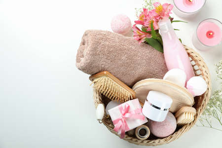 Concept of gift with basket of cosmetics on white backgroundの写真素材