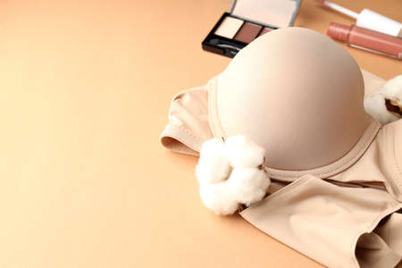 Concept of womens clothes with underwear on beige backgroundの写真素材