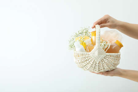 Concept of gift with basket of cosmetics on white backgroundの写真素材