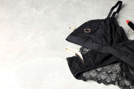 Concept of women's clothes with underwear on gray textured backgroundの写真素材