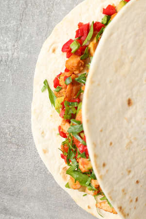 Tasty taco on gray textured background, close upの写真素材