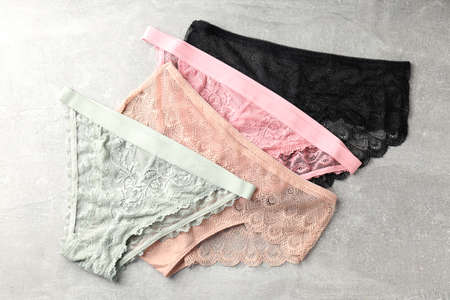 Beautiful womens panties on gray textured backgroundの写真素材