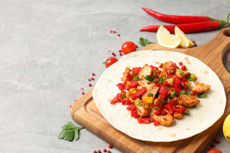 Concept of tasty food with taco on gray textured backgroundの写真素材
