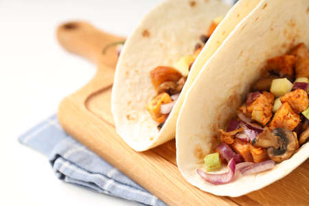 Concept of tasty food with taco on white backgroundの写真素材