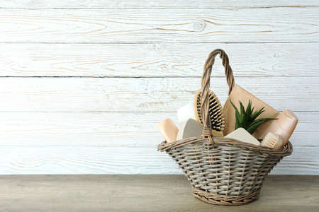 Gift basket with cosmetics on textured tableの写真素材