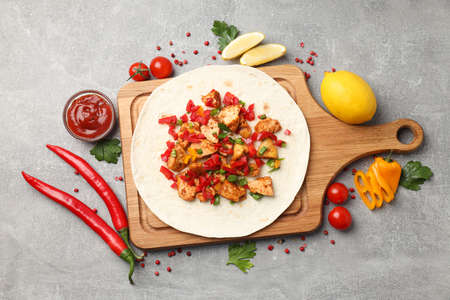 Concept of tasty food with taco on gray textured backgroundの写真素材