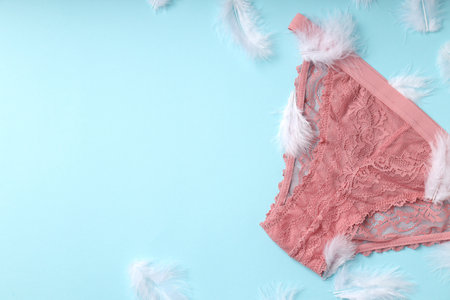 Concept of women's clothes with panties on blue backgroundの写真素材
