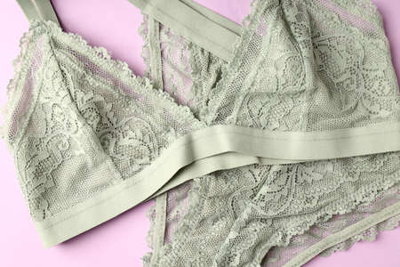 Beautiful set of women's underwear on purple backgroundの写真素材