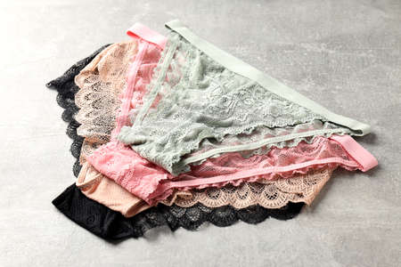 Beautiful womens panties on gray textured backgroundの写真素材