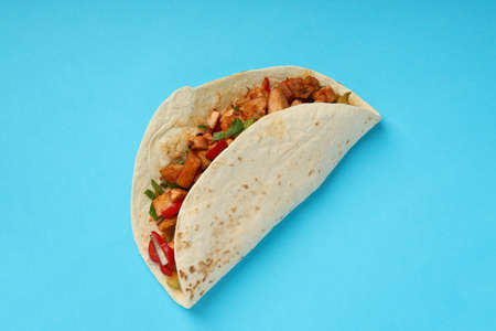 Tasty taco on blue background, close upの写真素材