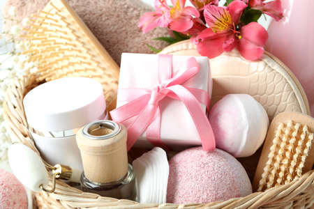 Concept of gift with basket of cosmetics, close upの写真素材