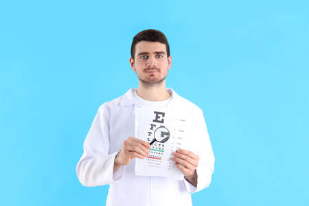 Eye doctor on blue background, healthcare concept