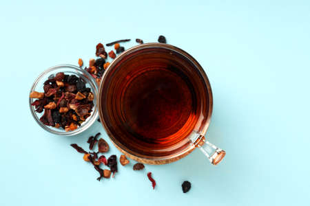 Concept of hot drink with tea on blue backgroundの写真素材