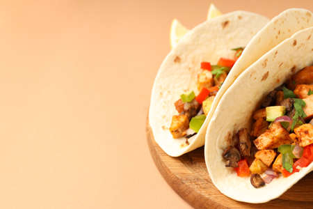 Concept of tasty food with taco on beige backgroundの写真素材
