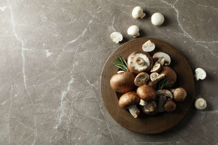 Concept of tasty food with champignon on gray textured backgroundの写真素材
