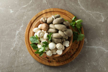 Concept of tasty food with mushrooms on gray textured backgroundの写真素材