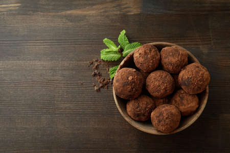 Concept of sweets with truffles on dark wooden backgroundの写真素材