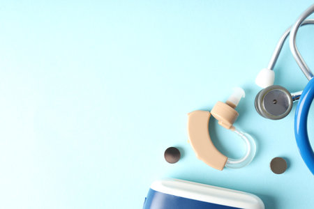 Concept of health care with hearing aid on blue backgroundの写真素材