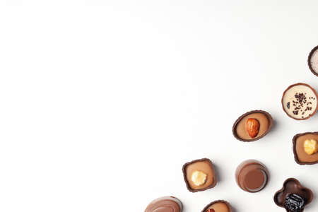 Flat lay composition with chocolate candies on white backgroundの写真素材