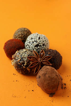 Concept of sweets with truffles on orange backgroundの写真素材