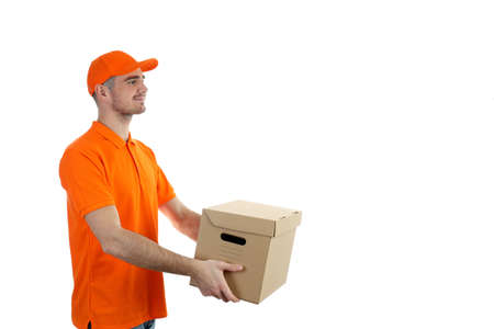 Delivery man holds box, isolated on white backgroundの写真素材