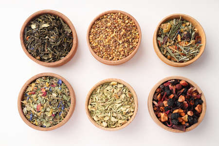 Flat lay with different types of tea on white backgroundの写真素材